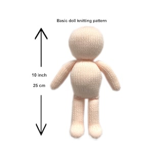 May include: A knitted doll in a light peach colour, with a rounded head, arms, and legs. The doll is approximately 25 cm (10 inches) tall. The text "Basic doll knitting pattern" is above the doll.