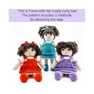 May include: Three handmade dolls with curly brown hair and knitted dresses in orange, teal, and purple. Each doll has a white face, arms, and legs. The image text reads, "This is Fiona with her lovely curly hair. The pattern includes 2 methods for attaching the legs."