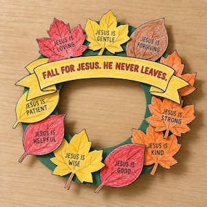 May include: A circular wreath craft featuring a green base adorned with paper autumn leaves in red, orange, yellow, and brown. Each leaf displays text such as Jesus is loving, gentle, forgiving, patient, strong, kind, wise, and good. A yellow banner across the centre reads, Fall for Jesus. He never leaves.