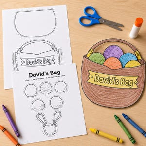 Puede incluir: Un set de manualidades que incluye dos hojas de papel blanco con dibujos de líneas negras de una bolsa y formas circulares etiquetadas como David's Bag, una cesta de papel coloreada con cinco recortes, tijeras azules, pegamento y ceras.