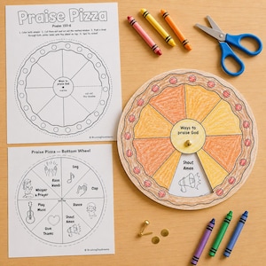 May include: A paper craft activity titled Praise Pizza with Psalm 150:6, featuring two printed sheets, a circular pizza-themed wheel with a brass fastener, blue scissors, and six crayons in pink, yellow, orange, purple, green, and blue colours.