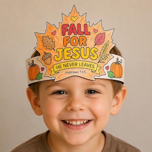 May include: A paper crown shaped like a large maple leaf, colored in orange and yellow. It features the text FALL FOR JESUS, HE NEVER LEAVES, and Hebrews 13:5. The design includes illustrations of pumpkins, an acorn, leaves, and small hearts.