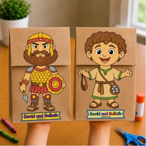 May include: Two brown paper bags featuring colorful illustrations of David and Goliath. The left bag shows a bearded warrior in gold armor holding a spear and shield. The right bag shows a young person with a sling and stones. Both have labels reading David and Goliath.