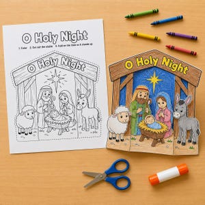 May include: A paper craft activity featuring a black and white colouring sheet titled O Holy Night with a nativity scene, a completed coloured version of the nativity scene, five coloured crayons, a pair of blue scissors, and a glue stick.