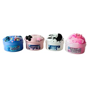 May include: Four small pots of colourful slime. The pots are labelled "Stitch Butter", "Strawberry Bubble Tea", "Cookie's & Cream", and "Axolotl Frost". Each pot has decorative toppings, such as beads, boba, and a cookie.