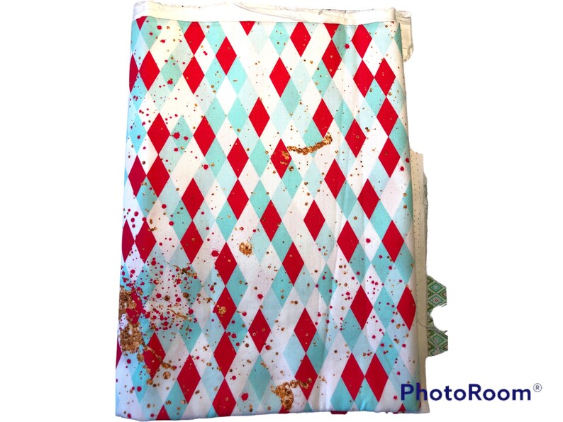 1 Yard Argyle theme in Teal, red with spots of glitter throughout Background in this cotton Woven fabric. image 1