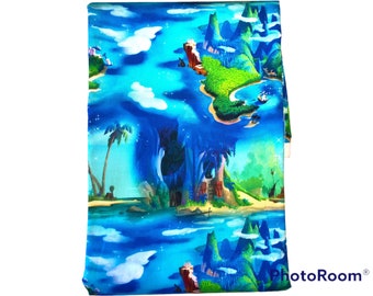 Peter Pan Fabric 1 yard cotton woven. Featuring blue background and Treasure Island.