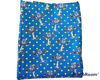 Pixar’s Toy Story fabric features Forkie on blue stars background - Cotton Lycra Fabric 1 yard