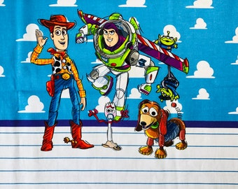 Toy Story adult panel - Cotton Lycra Fabric.