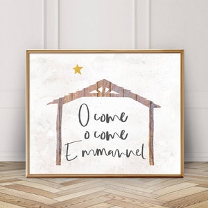 May include: A white background with a rustic wooden manger silhouette and the text "O come o come Emmanuel" in grey lettering. A gold star is in the top left corner.