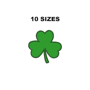 May include: A green embroidered shamrock with a dark green outline, set against a white background. The text "10 SIZES" is above the shamrock. This design is suitable for St. Patrick's Day crafts and apparel.