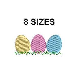 Puede incluir: Tres huevos de Pascua en colores amarillo, rosa y azul, sentados sobre un diseño de hierba verde. El texto "8 SIZES" está por encima de los huevos.