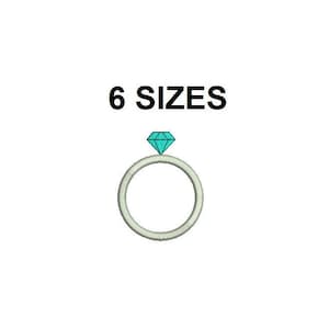 May include: A white ring with a blue diamond on top. 6 SIZES.