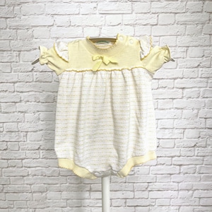 May include: A pale yellow and white knit romper featuring short ruffled sleeves, a ribbed mock neckline, and a small yellow bow at the center chest. The garment has a gathered bodice with a subtle horizontal textured pattern and ribbed leg openings.