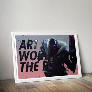 May include: A framed print featuring a black and white illustration of a masked figure with a large weapon. The text "Art is work, the rest is just play" is printed on the image.