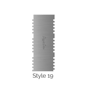 May include: A silver cake decorating comb with a textured surface and the text "Lissi's Lean" printed on it. The comb is labelled "Style 19".