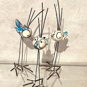 Set of birds to decorate. Long-legged birds with big eyes. Crazy bird. funny bird. Porcelain bird. Artistic