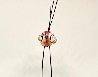 Pajaro de patas largas. Pajaro loco. Pajaro de porcelana fria. Pajaro para mesa. Figura de pajaro. Pajaro con ojos grandes. Adorno de pajaro