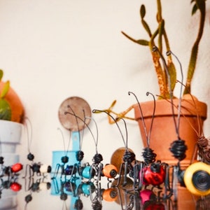 Ant made in Barcelona. Recycled art object, handmade ant sculpture on iron wire with carboy seed
