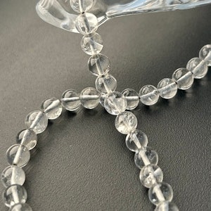 Quartz Crystal Round Beads: 14&quot; Strand, 5mm-6mm Gemstone Beads