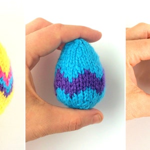 May include: Three knitted egg-shaped decorations in varying sizes. The largest is yellow with a blue and pink chevron pattern. The medium egg is light blue with a purple chevron pattern. The smallest egg is solid pink with a textured knit finish.
