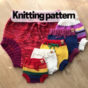 May include: Knitting pattern for a set of colorful knit baby bloomers. The bloomers are made in a variety of colors, including red, yellow, blue, white, and purple. The bloomers are all different sizes, with the largest being a bright red and the smallest being a rainbow.