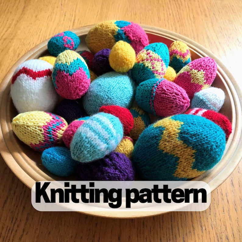 A wooden bowl filled with hand knitted Easter eggs in different sizes, each with different patterns and colours
