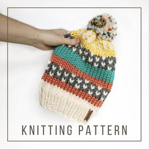 May include: Knitting pattern for a colorful striped beanie with a white pom pom. The beanie has stripes of yellow, teal, gray, and orange.