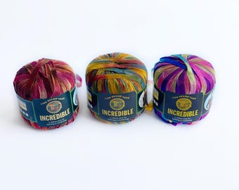 1 skein: Lion Brand Incredible (ribbon) Yarn - Autumn Leaves 206, Carnival 205, Copper Penny 208 - Discontinued Yarn