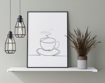 May include: A black framed print of a line drawing of a coffee cup with steam rising from it, hanging on a white shelf with two black pendant lights and a dried plant in a grey pot.