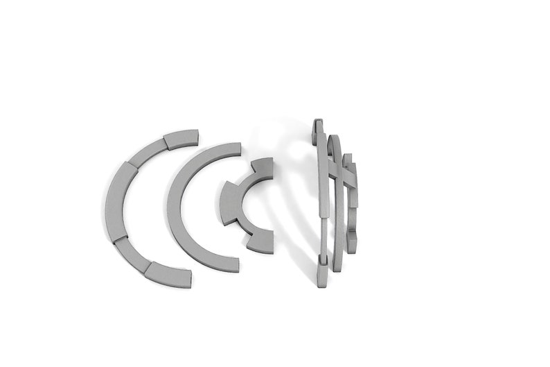 May include: A set of gray metal gears, some in a circular shape and others in a linear shape.