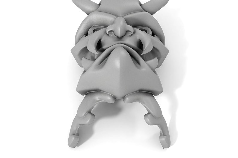 May include: A gray, detailed, 3D printed model of a demon mask with horns, fangs, and a furrowed brow.