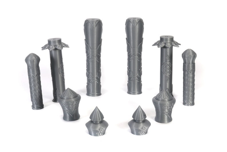 May include: A set of nine gray 3D printed decorative pieces, including columns, finials, and other architectural details.
