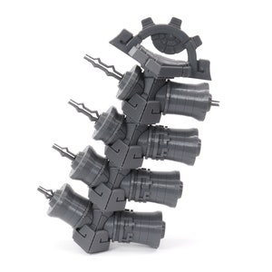 May include: A gray plastic model of a mechanical arm with five rotating joints and a gear at the top.