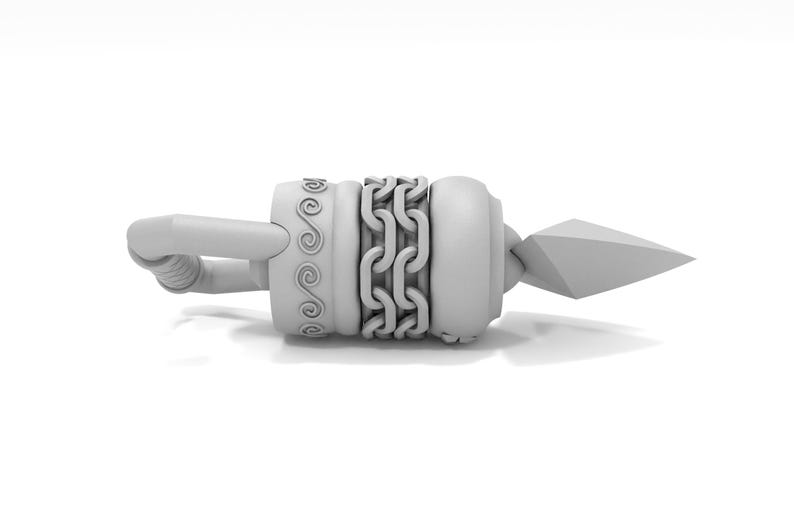 May include: A white metal decorative object with a chain and a pointed tip. The object has a decorative pattern on the side.