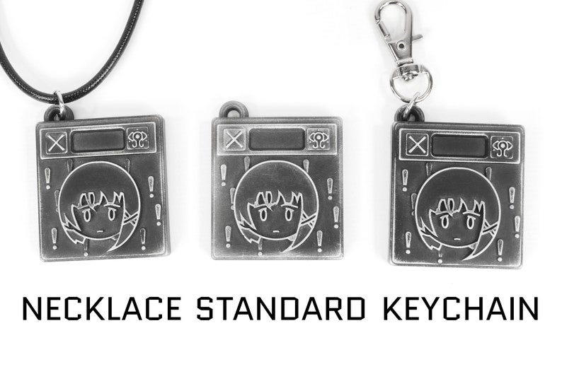 May include: Three silver-toned metal charms featuring a cartoon character with exclamation points around the character. The charms are available as a necklace, keychain, and standard keychain.