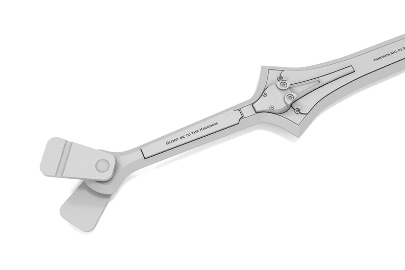 May include: A light gray, stylized sword with a complex design. The sword features a hinged mechanism near the center and the text "GLORY BE TO THE KINGDOM" is printed on the handle. The overall design is geometric and modern.