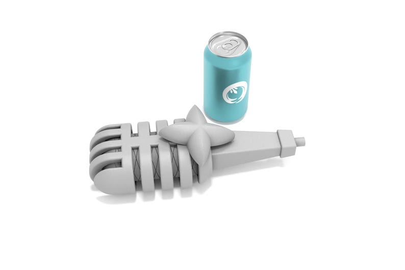 May include: A white microphone with a silver grill and a blue can of soda. The microphone is lying on its side with the can standing upright next to it.