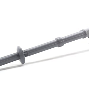 May include: A gray plastic tool with a gear-like handle and a threaded end. The tool is designed for installing drywall anchors.