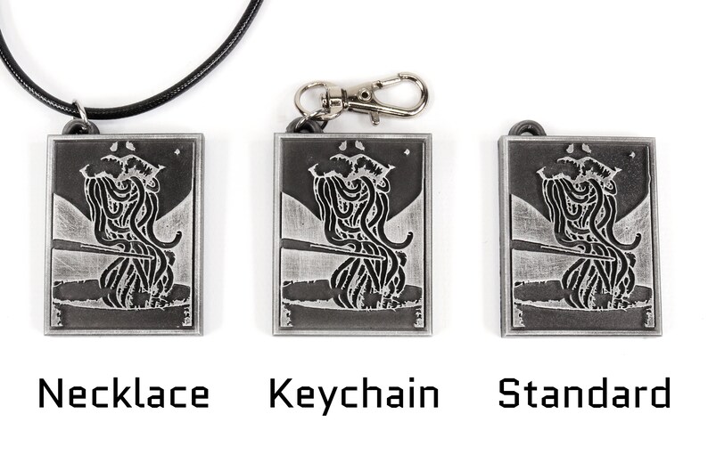 May include: Three silver metal pendants with a black and white image of a person eating noodles. The pendants are shown in three different styles: necklace, keychain, and standard.
