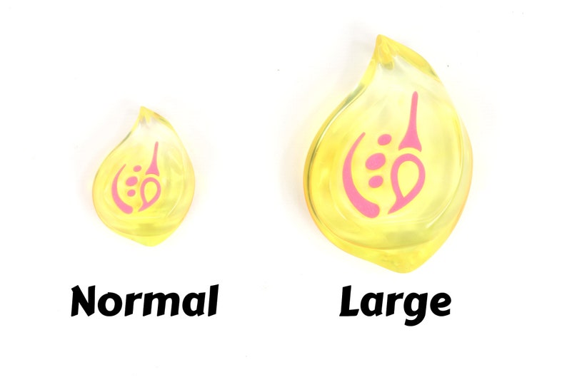 May include: Two yellow resin teardrop-shaped charms with a pink design. The charm on the left is smaller than the charm on the right. The text "Normal" is below the smaller charm and the text "Large" is below the larger charm.