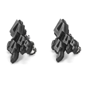 May include: A pair of silver-toned earrings with a geometric design featuring the number four. The earrings are made of metal and have a post back.