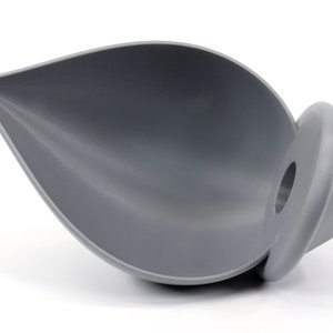May include: A gray silicone funnel with a round base. The funnel is shaped like a leaf and has a wide opening at the top.