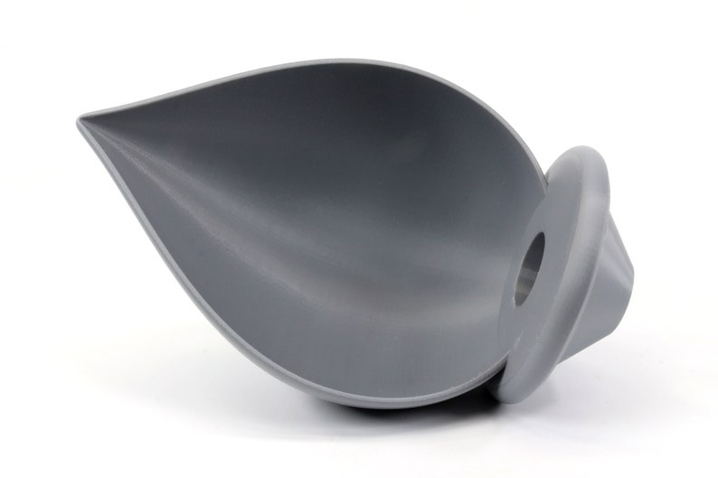 May include: A gray silicone funnel with a round base. The funnel is shaped like a leaf and has a wide opening at the top.