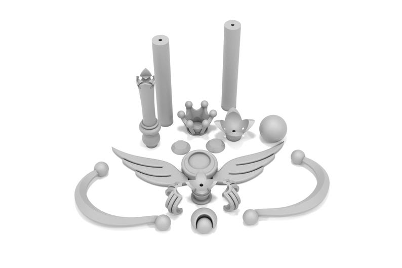 May include: A set of 3D printed pieces for a princess crown, featuring a crown, wings, and a wand. The pieces are all white and made of plastic.