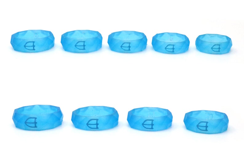 May include: Ten light blue silicone rings with a raised geometric design and a white logo. The rings are arranged in two rows of five.