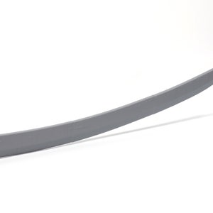 May include: A gray metal sword with a curved blade.
