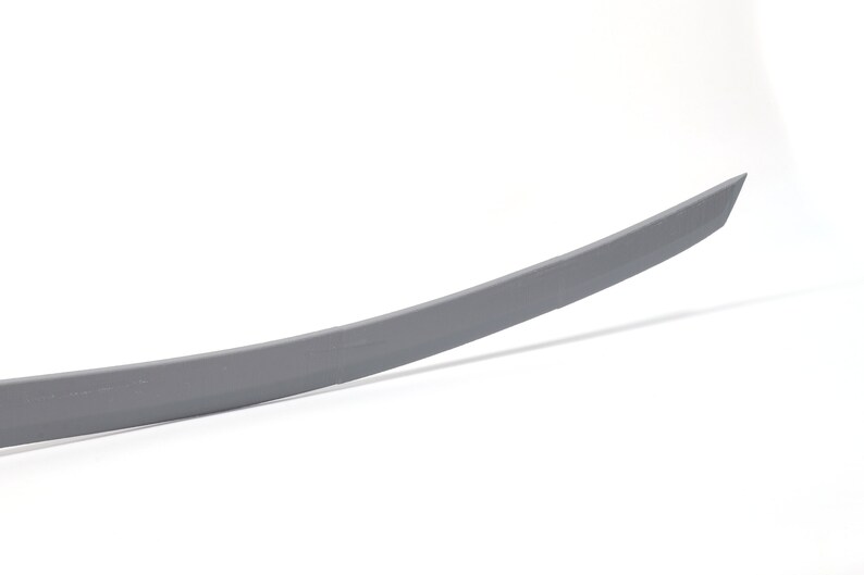 May include: A gray metal sword with a curved blade.