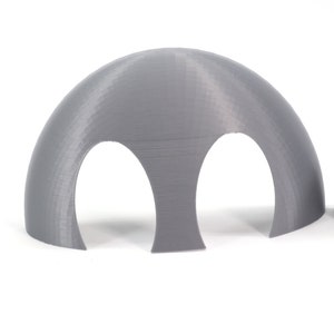 May include: Two gray 3D printed half dome shapes with two holes cut out of the bottom of each dome.