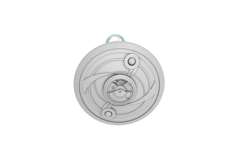 May include: A detailed, circular pendant with a complex, layered design. The pendant features concentric circles, curved lines, and small, circular accents. A small loop is at the top for hanging. The overall color is a light gray.